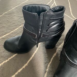 Black leather high heeled booties